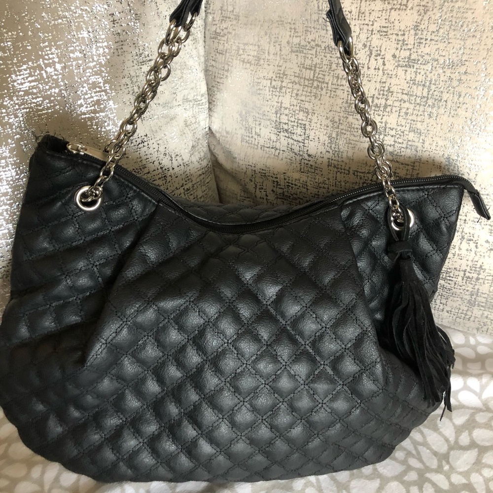 Clare’s black purse